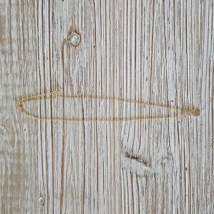 Gold pineapple necklace, $5